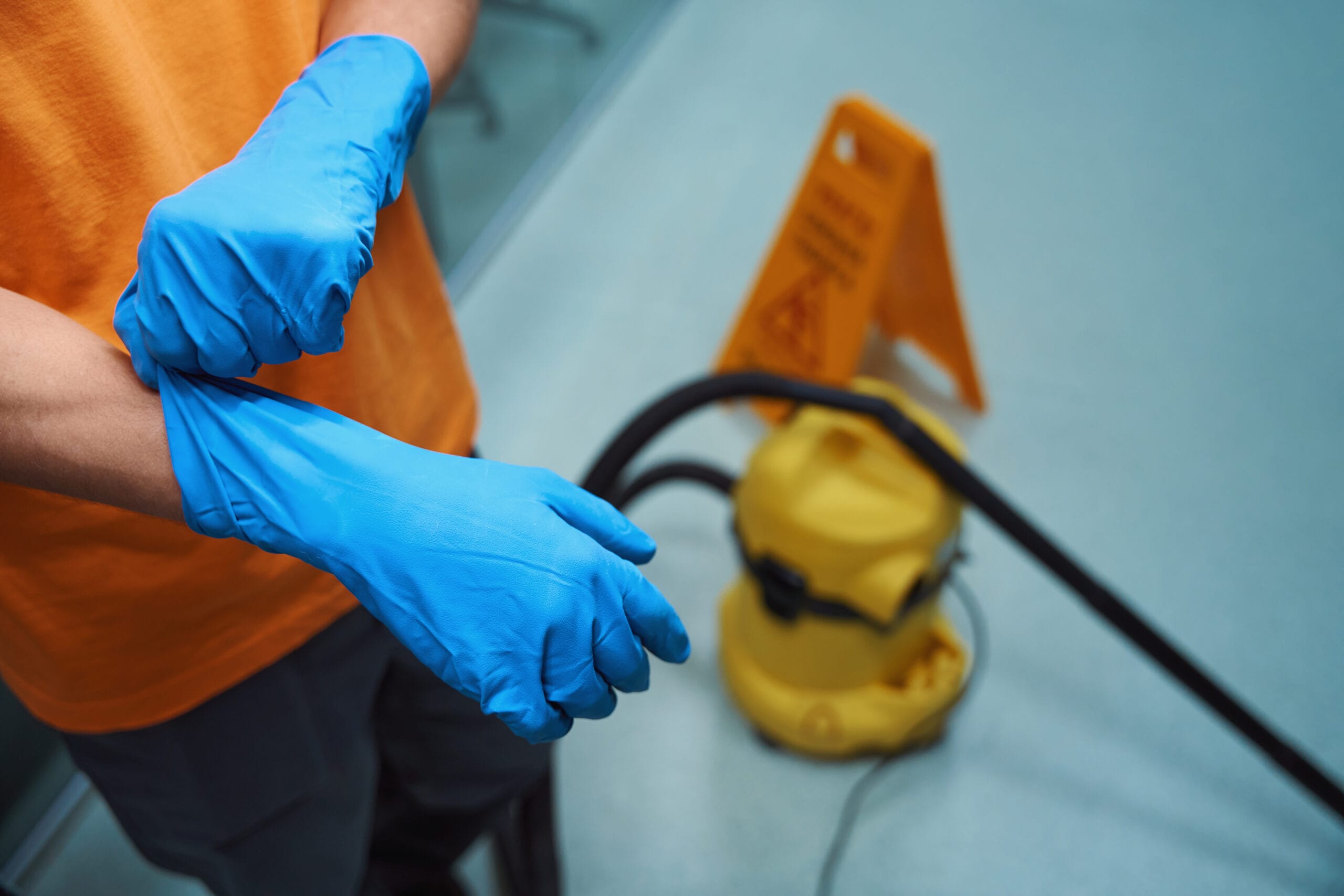 Professional cleaner using proper gloves during th 2024 10 19 22 46 30 utc scaled